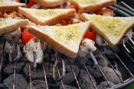 Summer barbecue, chicken meat, BBQ with vegetables and bradの写真素材