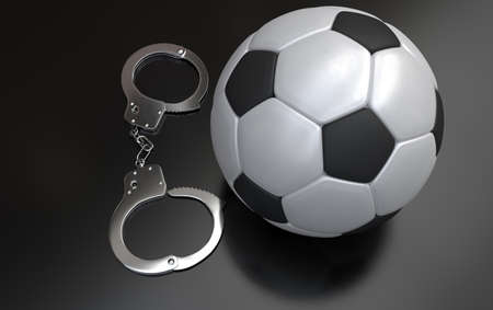 Soccer corruption, Soccer ball and handcuffsの写真素材