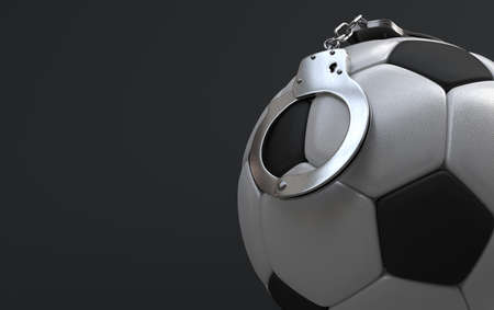 Soccer corruption, Soccer ball and handcuffsの写真素材