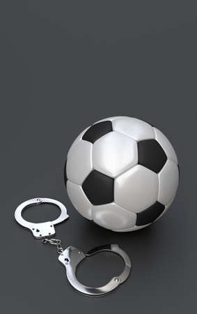 Soccer corruption, Soccer ball and handcuffsの写真素材
