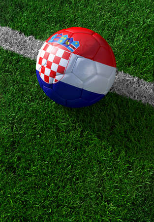 Soccer ball and national flag of Croatia lies on the green grassの写真素材