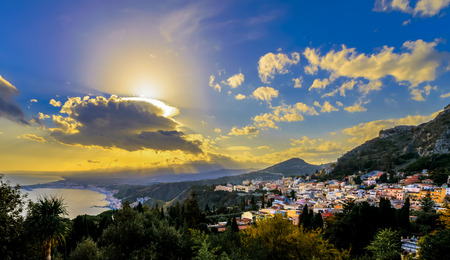 Taormina, Sicily view from the Greek theatre with sunrays over Etna mountainの写真素材