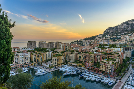 Aerial view of Monaco's harbour with yachts sailing  at sunsetの写真素材
