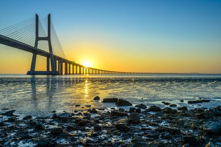 Vasco da Gama Bridge at sunrise, Lisbon, Portugalの写真素材
