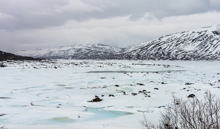 Frozen mountain lake with ice and snow-lake Stavatn in Telemark, Norway.の写真素材
