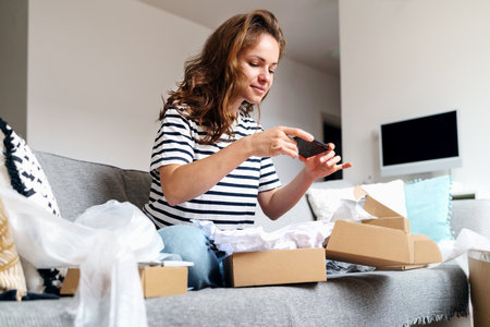 Woman taking picture of online purchase for leaving feedback about delivery and goods. Rating postal...