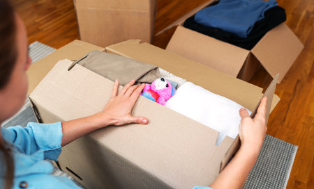 Charitable giving concept, packing children's toy and clothes for donation. Concept of hope.の写真素材