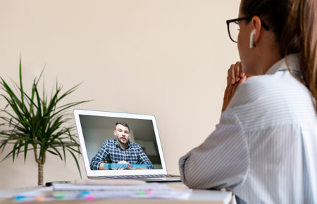 Two people colleagues man and woman have video call. Web conference, online meeting.の写真素材