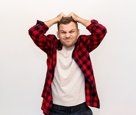 Annoying and fury expression emotions of male in front of white background.の写真素材