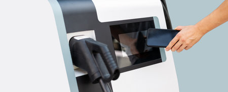 Contactless pay by mobile phone at the electric car station.