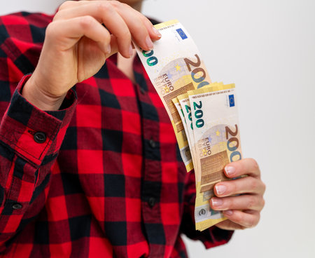 200 euro bills in female hands close-up.の写真素材