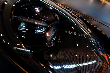 Porsche car black headlamp closeup. Novi Sad, Serbia - 09.08.2023.のeditorial素材