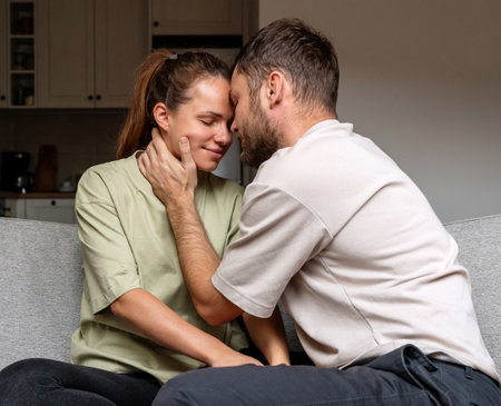 Tender and sensual relationship of a young adult heterosexual couple. Love and relationship.