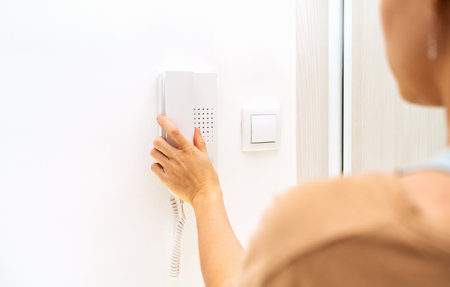 Using of intercom device at home.