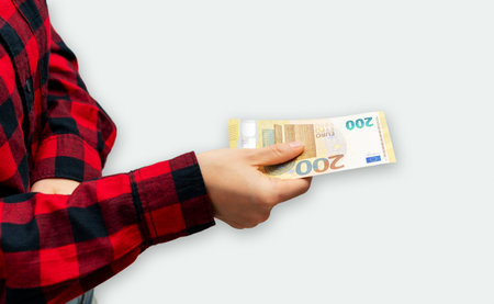200 euro notes in female hand. Giving money. Bribery and paying.