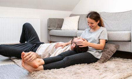 Young adult married couple is relaxing at home on the weekend.の写真素材