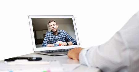 Using laptop for video call with colleague. Online meeting.の写真素材