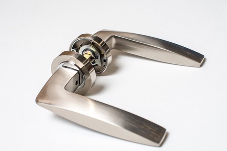 Metal door handle isolated on white backgroundの写真素材