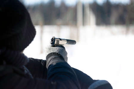 guy aiming with a pistolの写真素材