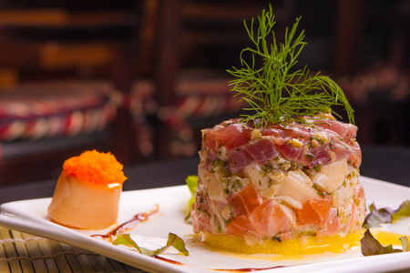 Traditional Peruvian Ceviche with salmon, white fish and tunaの写真素材