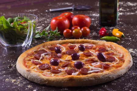 Brazilian Calabresa Pizza with olives and onionsの写真素材