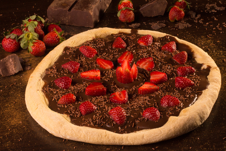 Strawberry Pizza Dessert with melt chocolateの写真素材