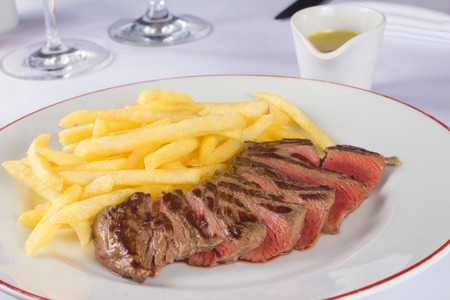 French entrecote steak with french fries and special sauceの写真素材