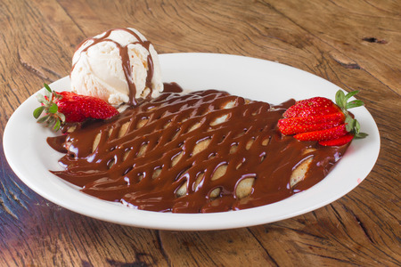 Chocolate Creppe Dessert with syrup, strawberry and vanilla ice creamの写真素材