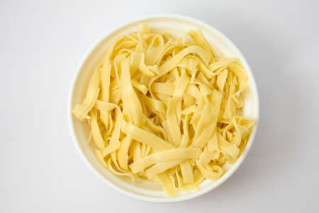 Fettuccinne into the pot ready to serveの写真素材