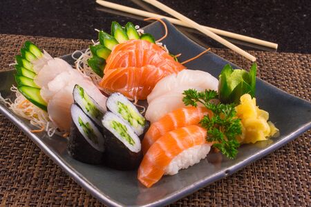 Traditional Japonese Food with sushi, sashimi and rollsの写真素材