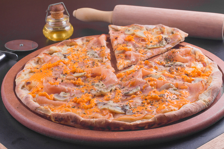 turkey ham Pizza with cheese cheddar and herbsの写真素材