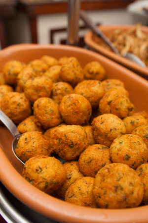 Traditional portuguese cod cake appetizer with herbsの写真素材