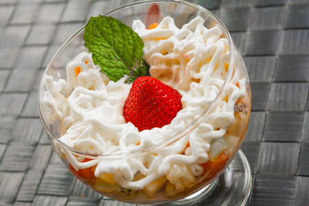 Fresh Fruit Salad Dessert with milk creamの写真素材