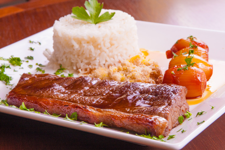 Brazilian Picanha Steak with egg farofa, rice and sweet onionsの写真素材