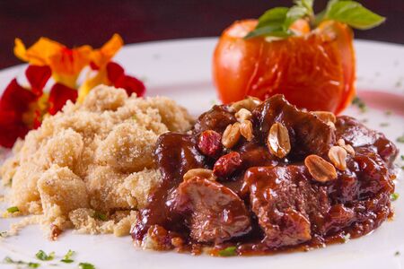 Fillet Mignon Appetizer with egg farofa and nutsの写真素材