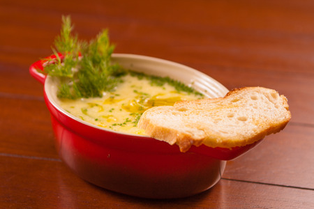 Gourmet Fondue Appetizer with herbs and bread toastの写真素材
