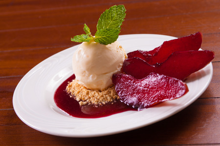 Seet Pear Dessert with nuts and ice creamの写真素材