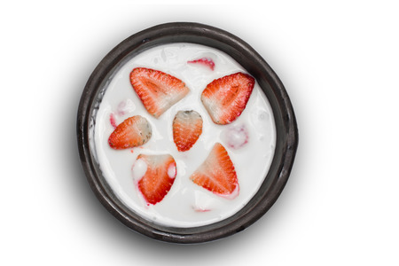 Milk with strawberry on white backgroundの写真素材