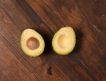 Fresh avocato over a wooden table