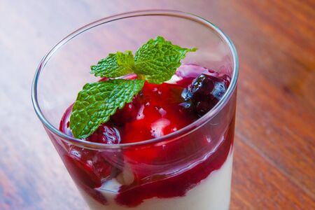 Red Fruits Dessert with berry and milk cream and yogurt