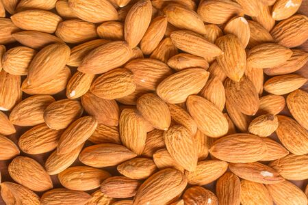 Close-up on Almonds over a wooden tableの写真素材