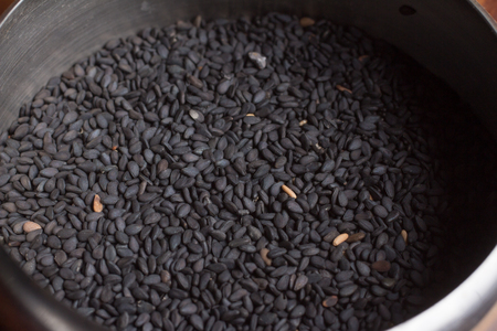 Close-up on black Sesame in the potの写真素材