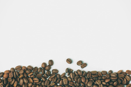 Coffee beans frame in white background. Coffea arabica