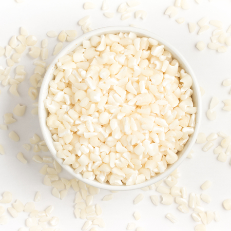 White grated corn kernels isolated in white backgroundの写真素材