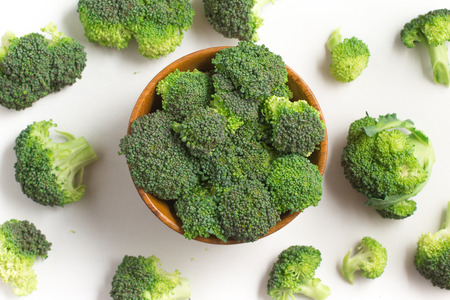 Broccoli into a bowl isolated in white backgroundの写真素材