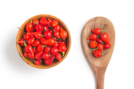 Biquinho Pepper into a bowl. Capsicum Chinense isolated in white background