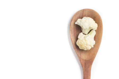 Cauliflower Cabbage into a spoon isolated in white backgroundの写真素材