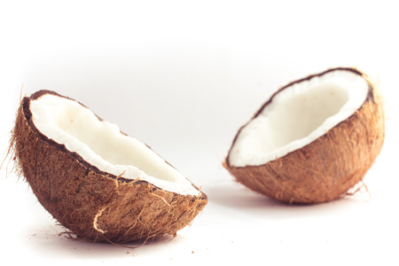 Dry Sliced Coconut on white background. Two Piecesの写真素材