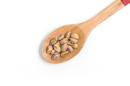 Heap of Pistachios isolated on white backgroundの写真素材