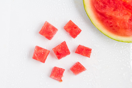 Refreshing Watermelon Pieces over a wet glass surfaceの写真素材